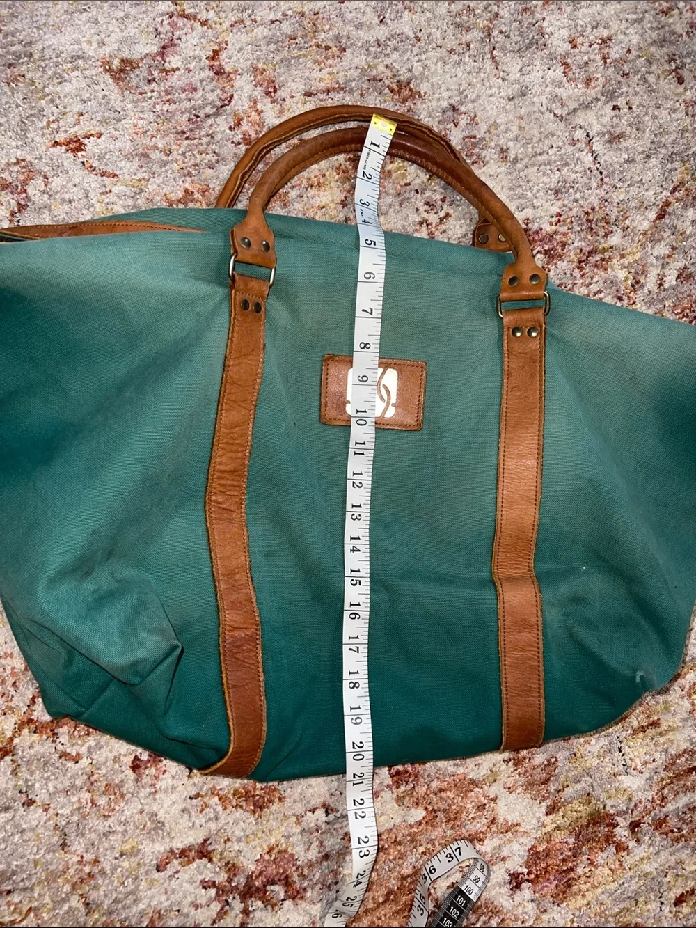 Vintage green duffle bag with leather handles
